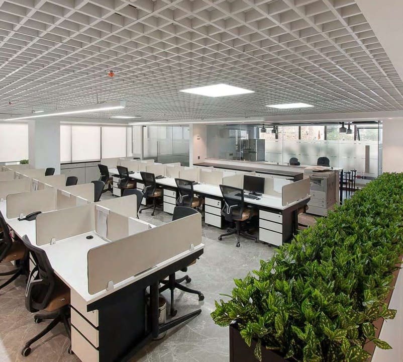 MR Group office reception with backlit gold logo and marble desk