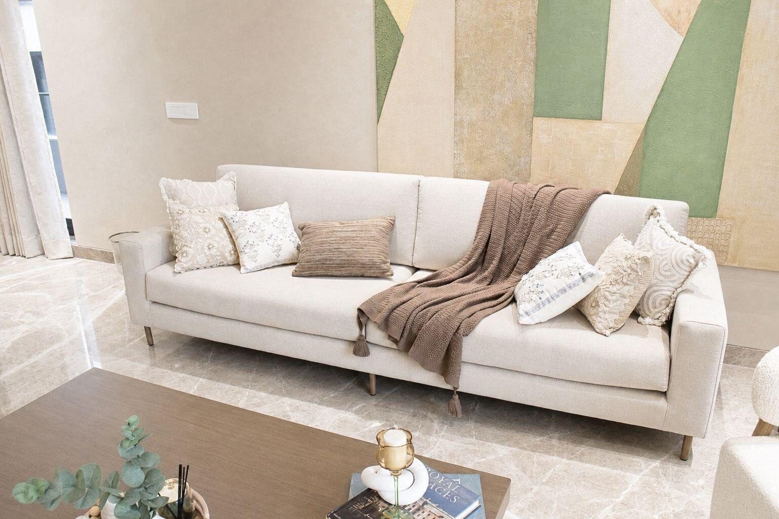 Chirag Enclave residence living area with warm materials and open layout