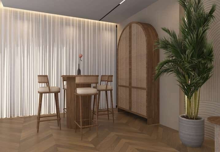 Breakfast bar beneath an arched rattan door with potted palm