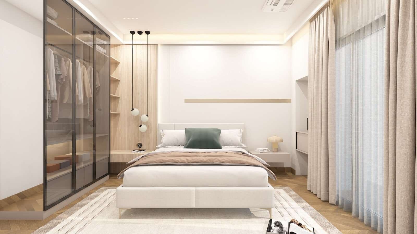 Walk-in wardrobe with glass-front cabinetry and dressing area