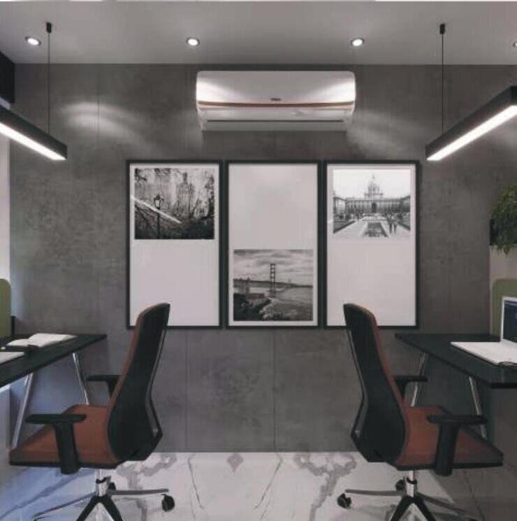 Meeting room with framed black-and-white city prints and leather chairs