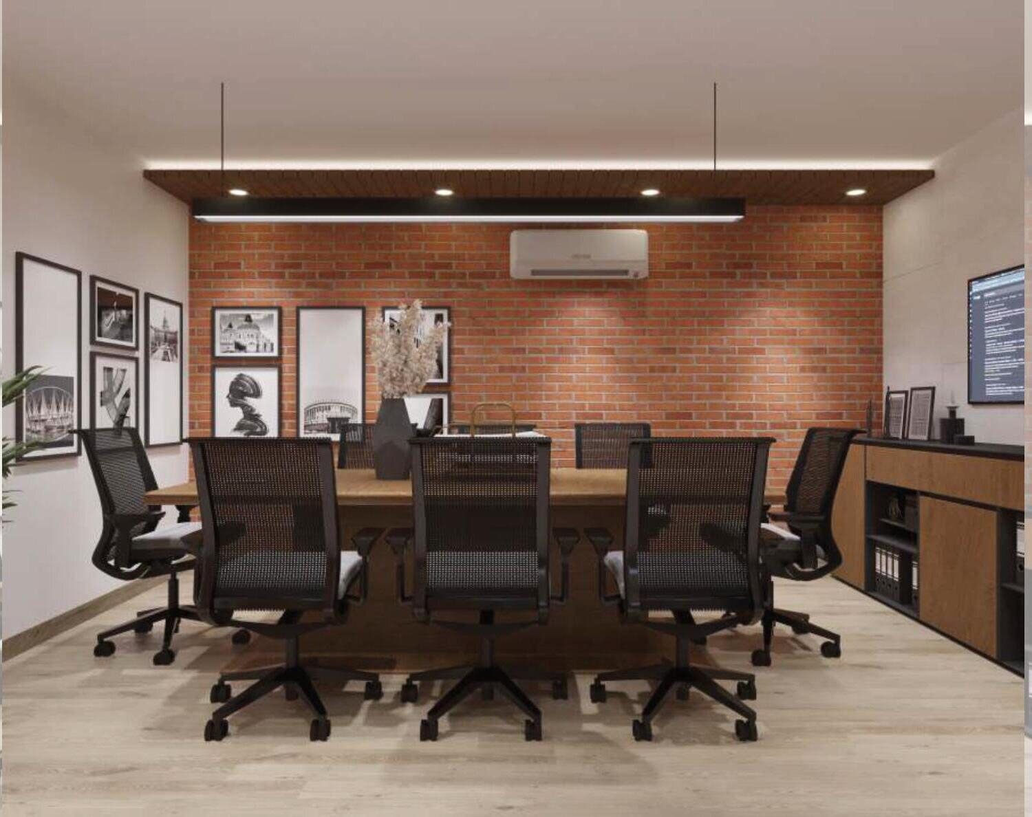 Exposed brick conference room with photo gallery wall and wooden table
